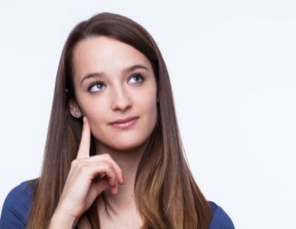 Young woman thinking portraying concern about wisdom teeth removal